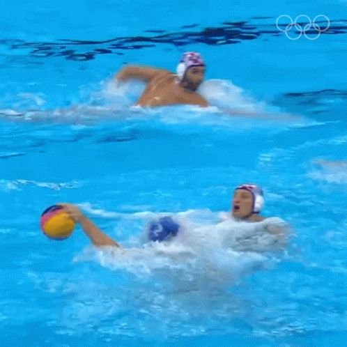two men swimming in a large body of water