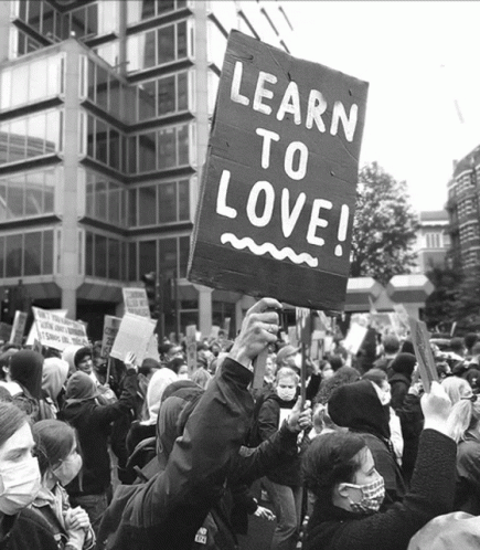 an image of people at a demonstration on love