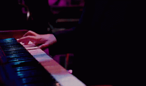 someone is playing a piano with their hands