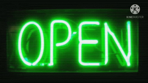 the neon sign says open with the black background