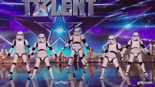 a group of storm troopers performing in front of people on stage