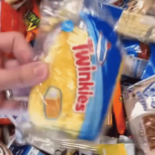 a hand picks up a condom bag filled with snacks