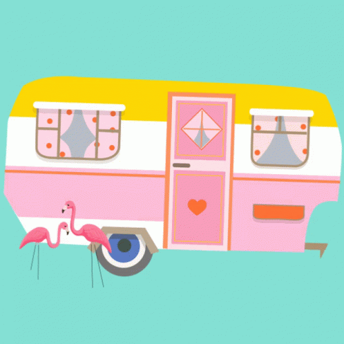 an image of a pink and white rv parked