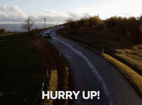 a car driving down a country road with a caption that reads hurry up