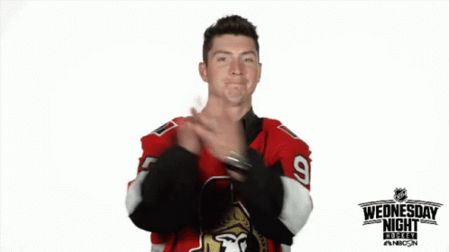 a man wearing a jersey making the middle finger sign