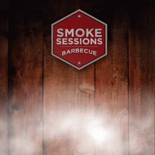 blue smoke signs are displayed on a wood panel wall