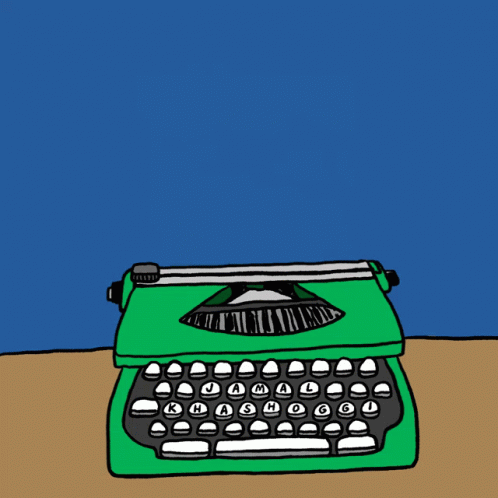 a green and black typewriter on a table