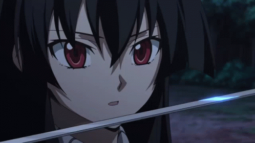 a female anime character with long black hair and dark eyes holding a stick with a light shining in front of her