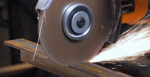 a machine making a blade that has been cut into strips