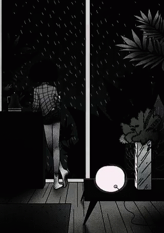 the person is outside on a rainy night