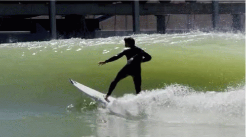 a person on a surfboard riding a wave