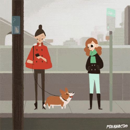 two people are outside on a city street and one is walking their dog