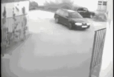 a surveillance image shows cars coming into an atm