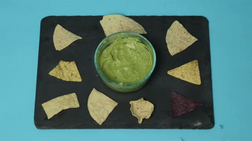 small chips with blue and green toppings on the top of them