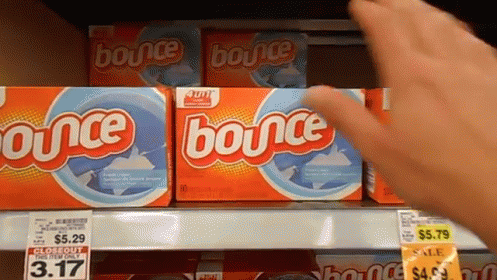two boxes of bounce are on display at a grocery store