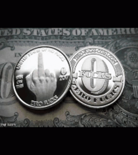 two silver coins with the finger up in front of it