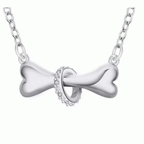 a white gold pendant with two hearts on it