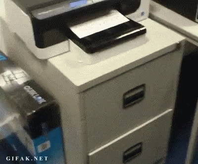 a fax machine sitting on top of a desk