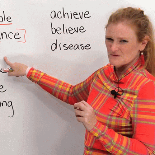 a woman writing on the whiteboard and asking about disease