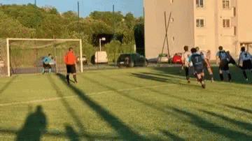 men playing soccer in a school field