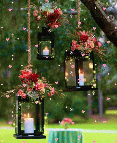 four hanging lanterns that have some candles inside