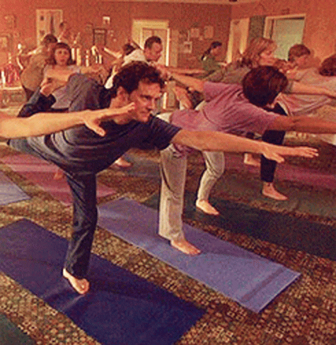 a group of people doing yoga together