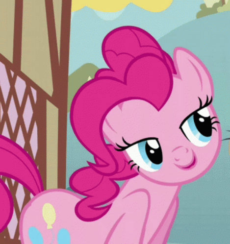 a pink pony looks over a gate at a person