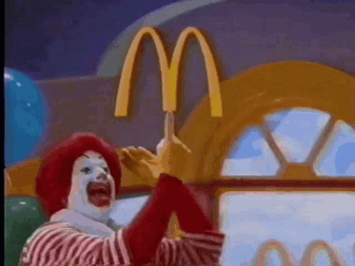 a cartoon character is performing in front of a mcdonalds
