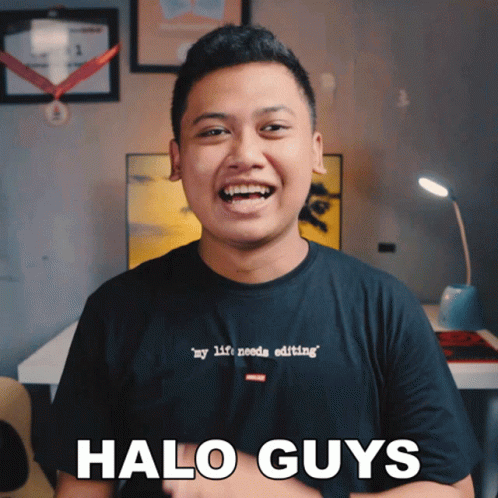 a man that is standing up smiling with the text halo guys