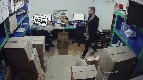 a man walks into a computer room with monitors