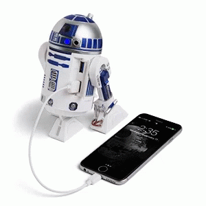 the star wars r2d - d2 light up phone charging station is shown next to a cellphone
