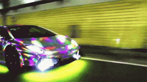 a close - up po of an automobile's motion blurry image