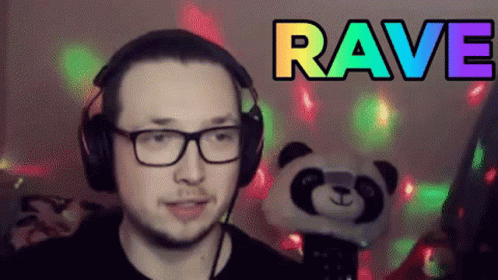 there is a man with headphones on, wearing a panda face