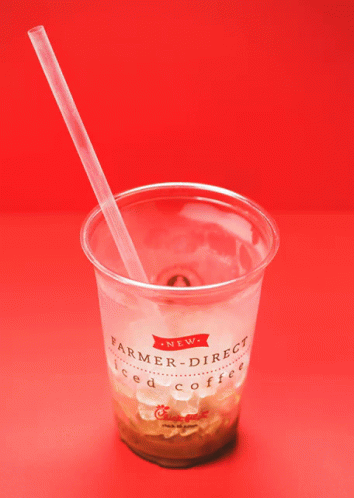 a plastic cup with a straw inside it
