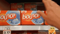 the person is picking out a box of bounce cereal