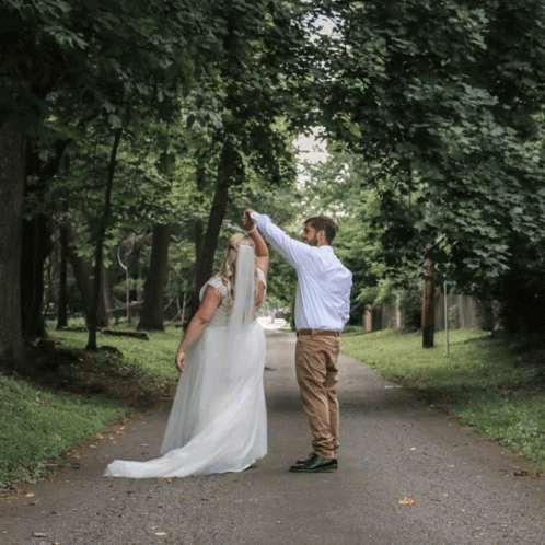 a man is walking down the road with a bride