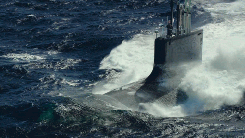 a military submarine being battered by waves