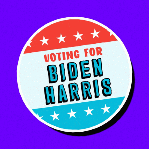 a sign that reads voting for biden harris on it