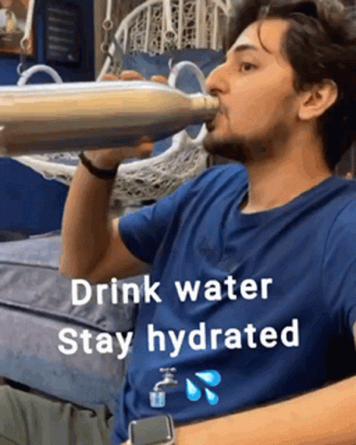 a man drinking from a water bottle with a caption on it
