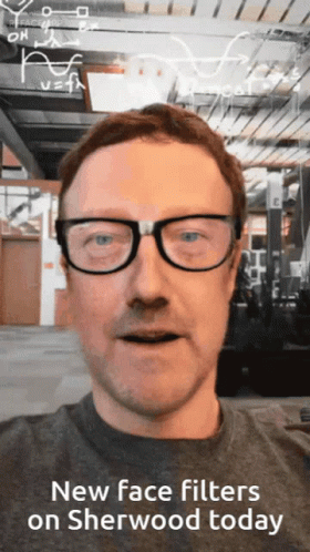 a man wearing glasses and a new face filters