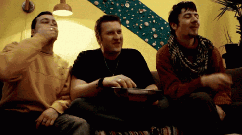 three men playing a game with their nintendo wii controller