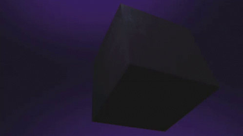 a triangle object that is lit up in the dark