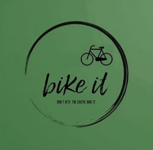 a green background with a bicycle and text on it