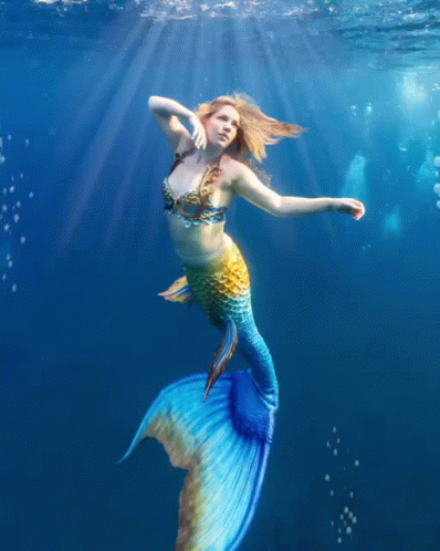 mermaid swimming in the water, wearing a bikini