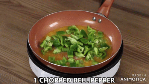 a blue pan filled with chopped green peppers