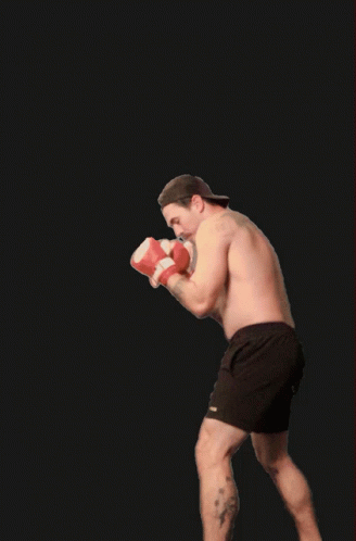 a man in boxing trunks on a kickbox