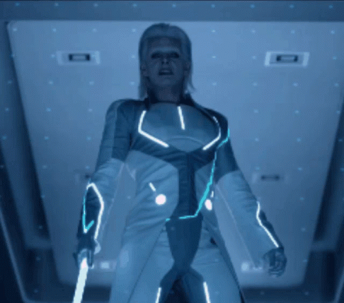 a woman dressed as a sci - fior standing in the middle of a hallway
