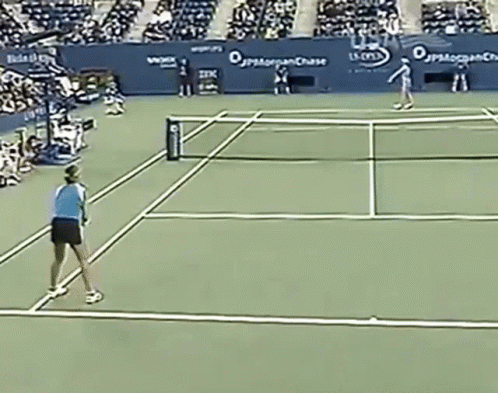 a tennis game is in the middle of a tennis court