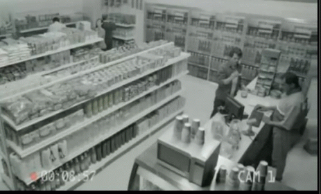 two people in the supermarket with cans and bottles