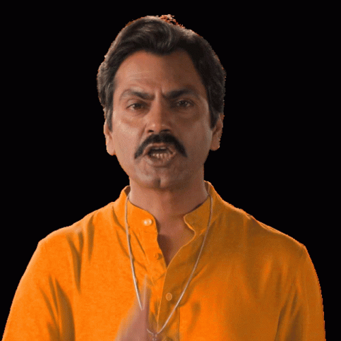 a man is wearing a blue shirt with a moustache